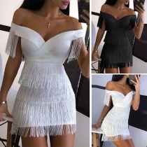 Sexig, off shoulder klänning med boat neck och tofsar