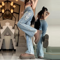 Retro fjärilsbroderade utsvängda jeans med hög midja, råkant