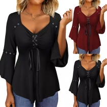 Mode blus med rund hals och 3/4-ärmar med oregelbunden kant