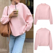 Söt och stilren rosa långärmad tröja med rund hals och enfärgad design