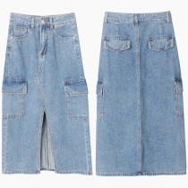 Vintage denimkjol med slitade sidofickor och gammaldags tvätt