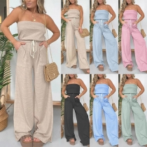 Sexig axelbandslös jumpsuit med dragsko i midjan och vida ben
