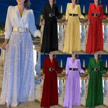 V-ringad långärmad paljettkantad jumpsuit med vida ben och bälte