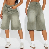 Gatumode slitna jeansbermudashorts med bälte