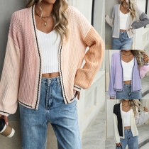 Långärmad stickad cardigan med kontrastfärger