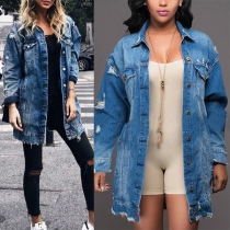 Mellanlång distressed denim trenchcoat