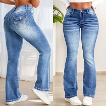 Moderiktiga högmidjade jeans med utsvängda ben i vintage-tvättad denim