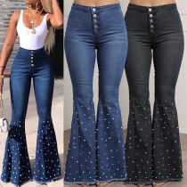 Jeans med hög midja och pärldetaljer i stretchmaterial