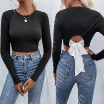Sexig crop top med rosett och långärmad rygglös design i crew-neck-stil