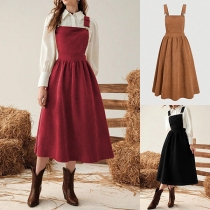 Vintage enfärgad klänning med fickor, resårmidja och justerbara axelband