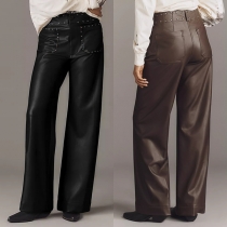 Trendiga högmidjade byxor med nitar och konstläderfickor, rak passform