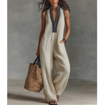 Damjumpsuit med djup V-ringning, boho-stil, ärmlös, vida ben och praktiska fickor