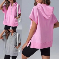 Gatufashion med halv dragkedja, kortärmar och kängurufickor - sportig tröja